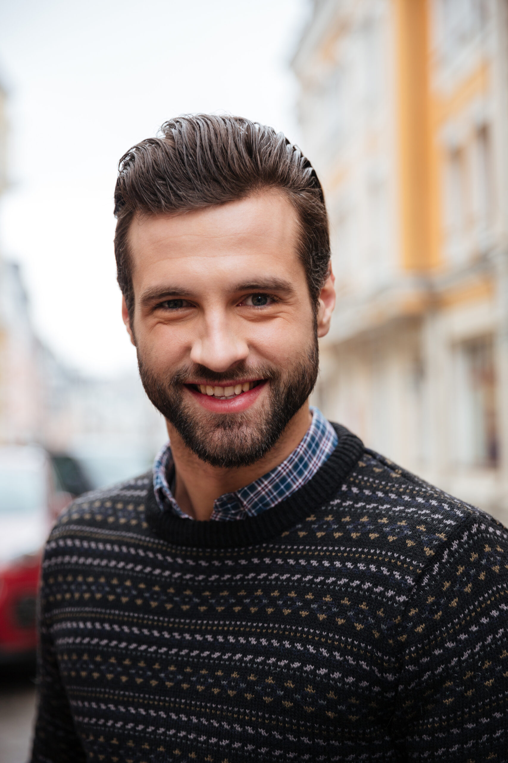 close up portrait of a young smiling man
